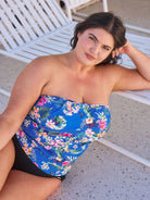 Brunette model wears stunning blue floral bandeau tankini top with removable straps