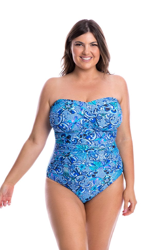 Model wearing strapless blue swimsuit