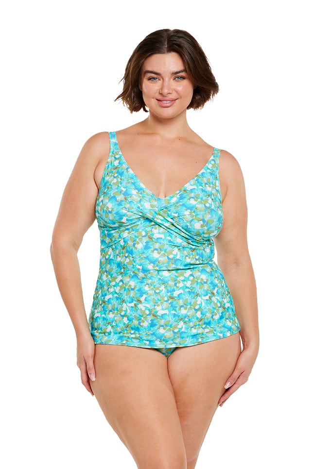 Brunette model showing front of blue and green tankini
