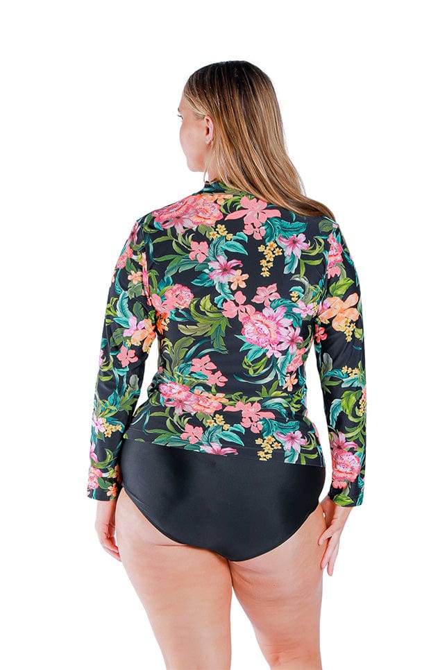 Model wearing floral and black printed long sleeved rash vest with zip front