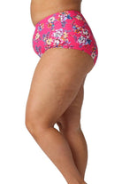 Model showing side of pink floral high waisted bikini bottoms