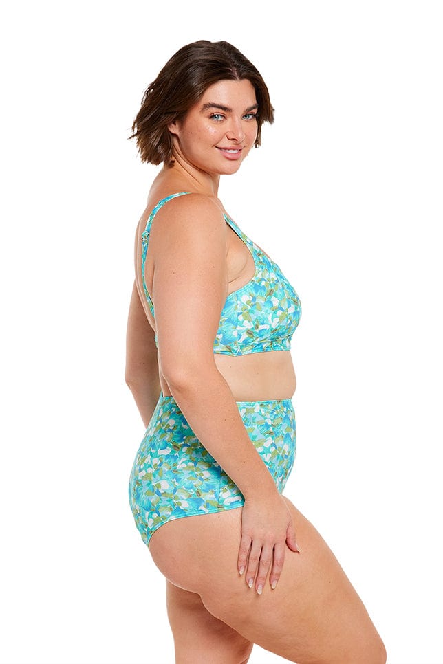 Brunette plus size model wears turquoise blue tummy control high waisted bikini bottom