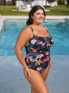 Woman wearing a floral swimsuit by a pool