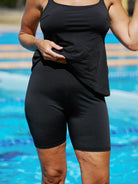 Blonde women at the pool wearing black mid thigh chlorine resistant bike swim pant