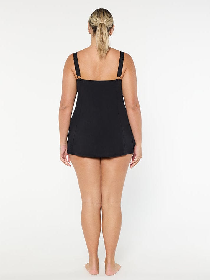 Person wearing a black swimsuit on a white background