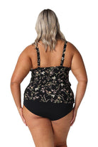 Model showing back of black floral ruffle tankini