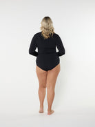 Person wearing a black swimsuit on a white background
