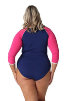 Model showing back of navy and pink womens one piece with sleeves