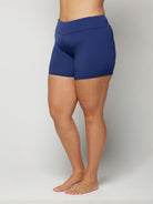 Blue chlorine resistant swim shorts worn by a person on a plain background