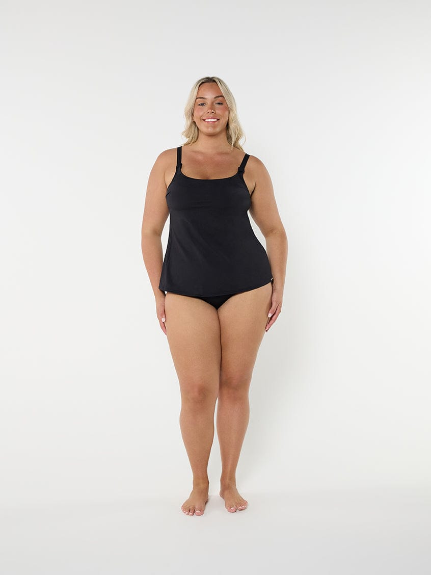 Woman wearing a black swimsuit on a white background
