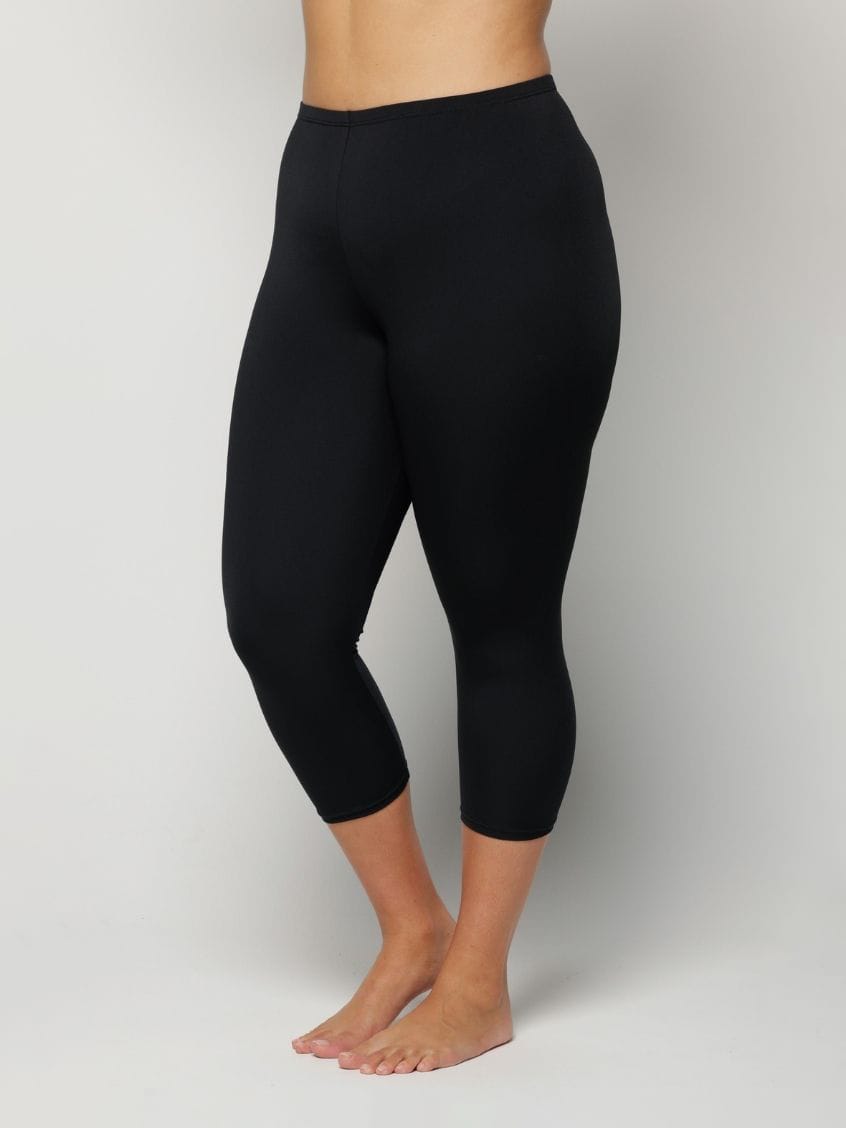Black leggings worn by a Woman on a plain background