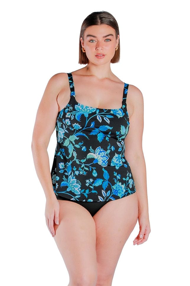 dark haired women wearing a turquoise floral chlorine resistant one piece swimsuit