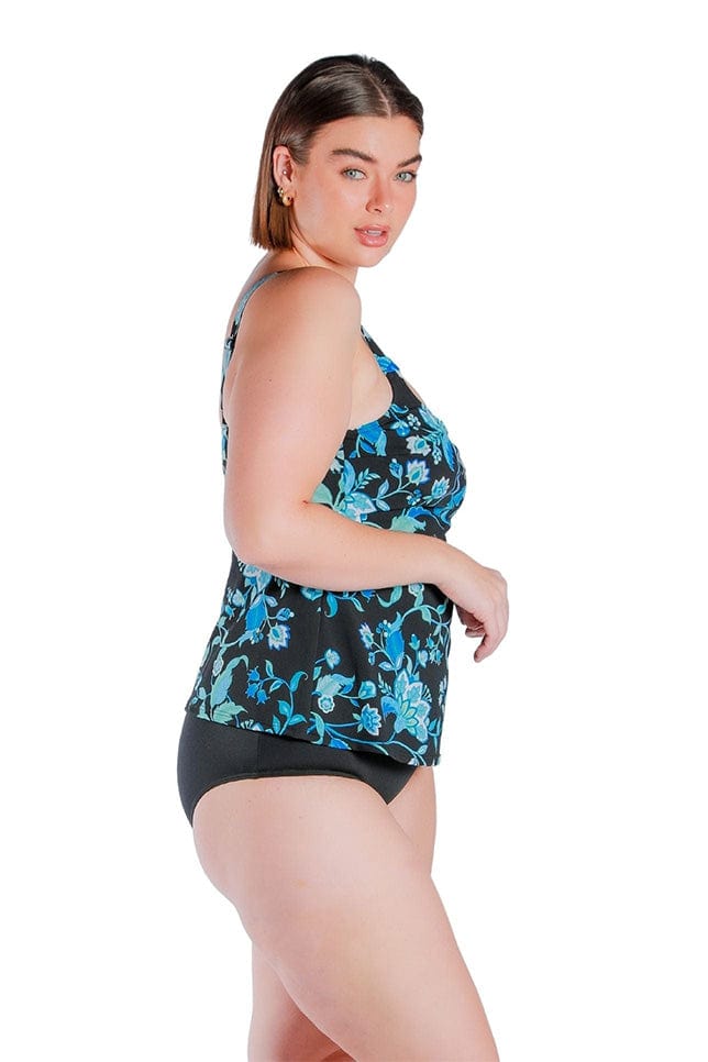 side view brunette women wearing a chlorine resistant turquoise floral tankini top 