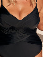 Black dress with a plunging neckline on a person.