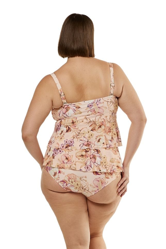 back of model wearing soft peach and pink floral bandeau tankini top with two tier layers