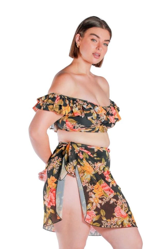 side profile of a model wearing a black floral mesh beach wrap