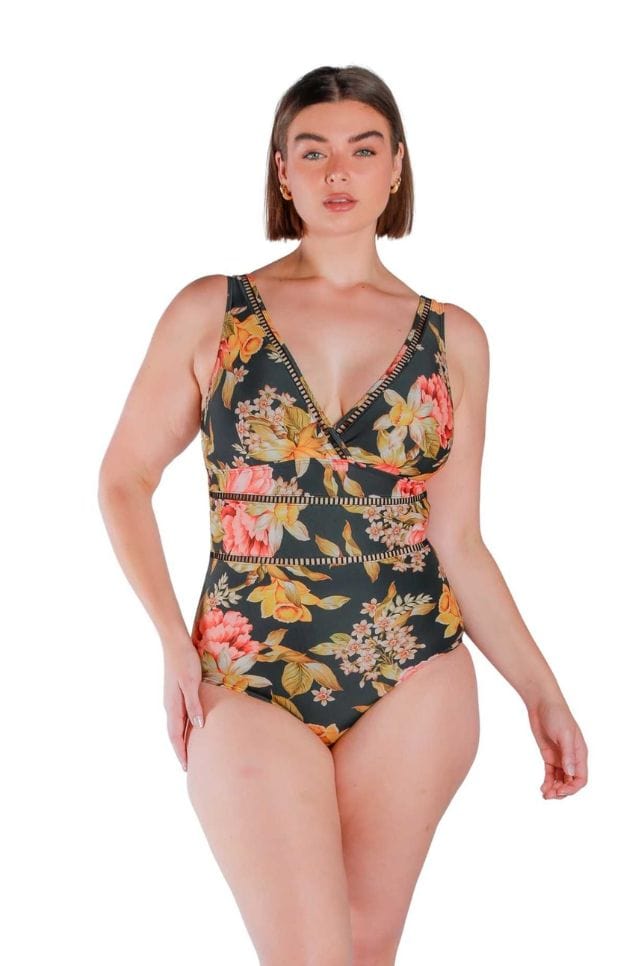Model wearing floral and black printed V neck one piece
