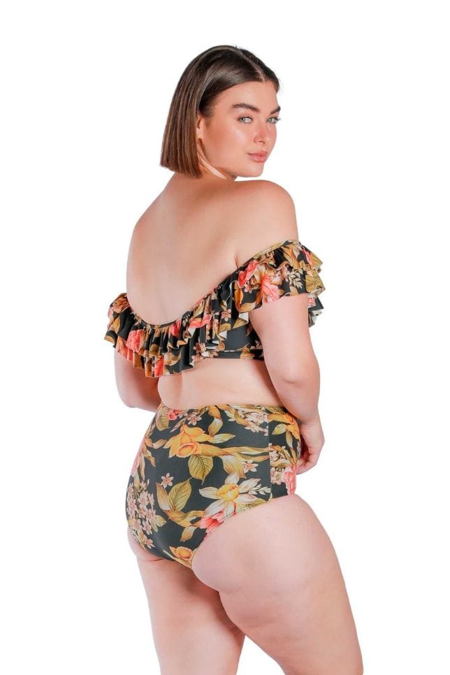 Model wearing floral print tummy control high waisted swim pant with black base