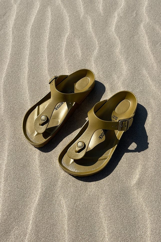 Ladies beach Birkenstock Gizeh Eva slip on sandals in gold colour