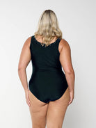 model showing back of blue and black high neck one piece