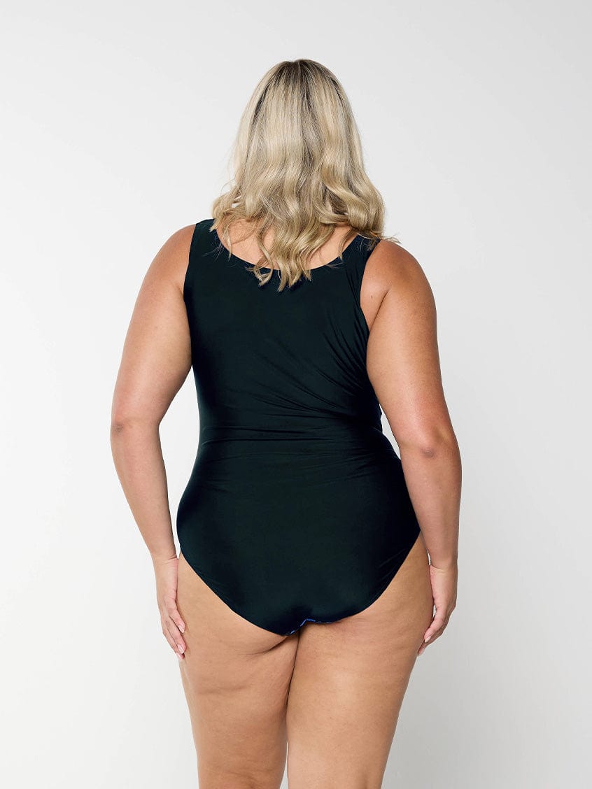 model showing back of blue and black high neck one piece
