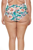 model wears high waisted tummy control swim bottom in green floral
