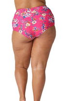 Model showing back of hot pink floral full coverage swim bottoms