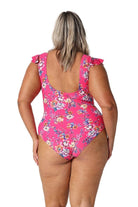 Model showing scooped back of hot pink floral one piece swimsuit