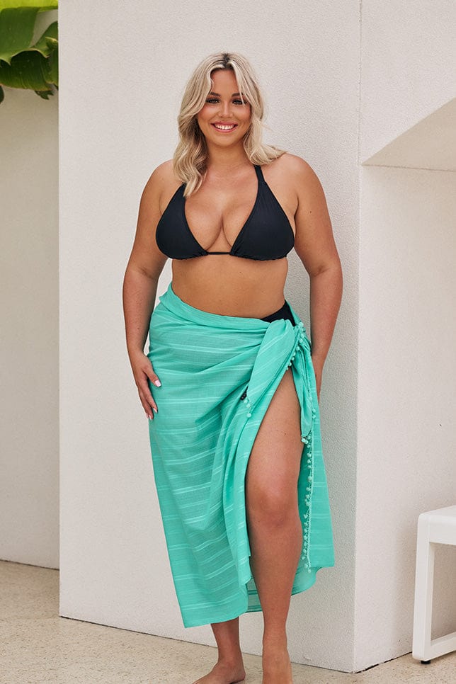 Blonde model wearing jade coloured sarong