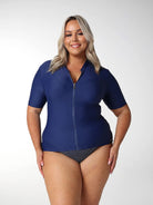 Model showing front of short sleeve rash vest with a full zip