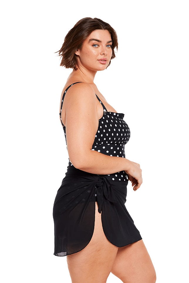 Brunette model wears black mesh lightweight short sarong skirt
