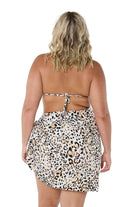 Model showing back of light leopard print sarong tied on the side