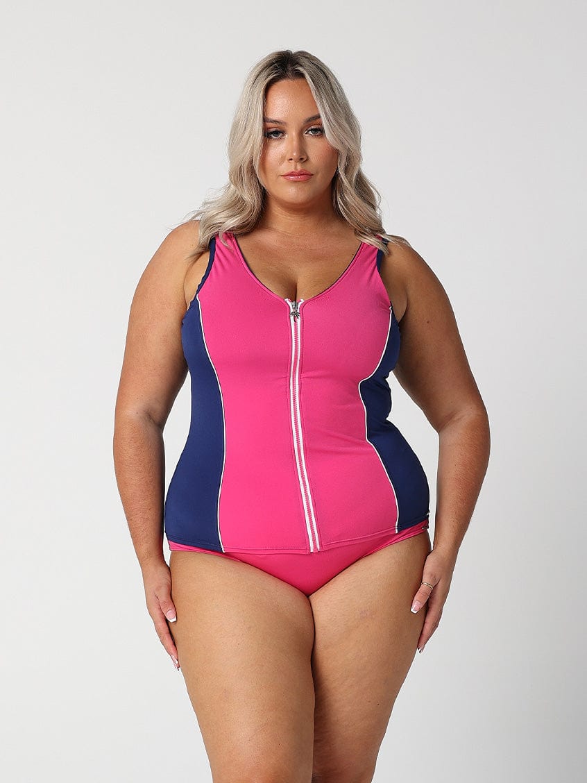 Model wearing pink and navy zip front tankini top
