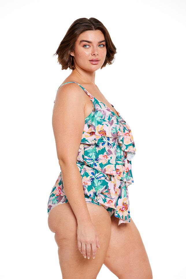 brunette plus size women wearing green and pink floral tankini top with adjustable straps