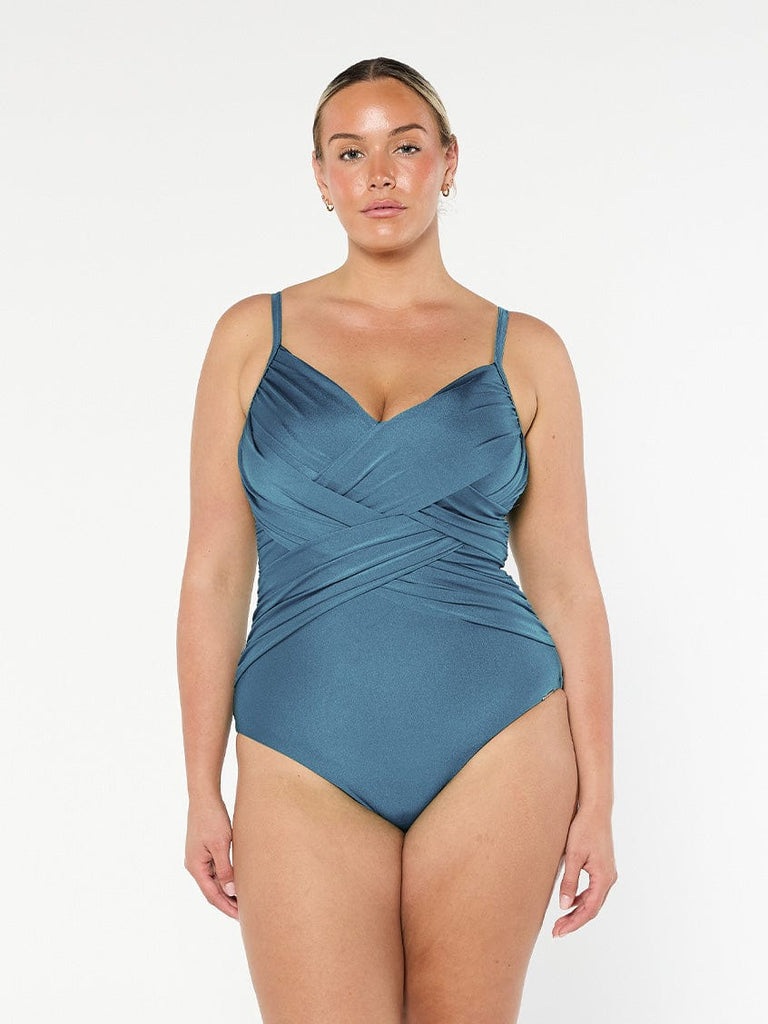 model wearing metallic grey criss cross one piece