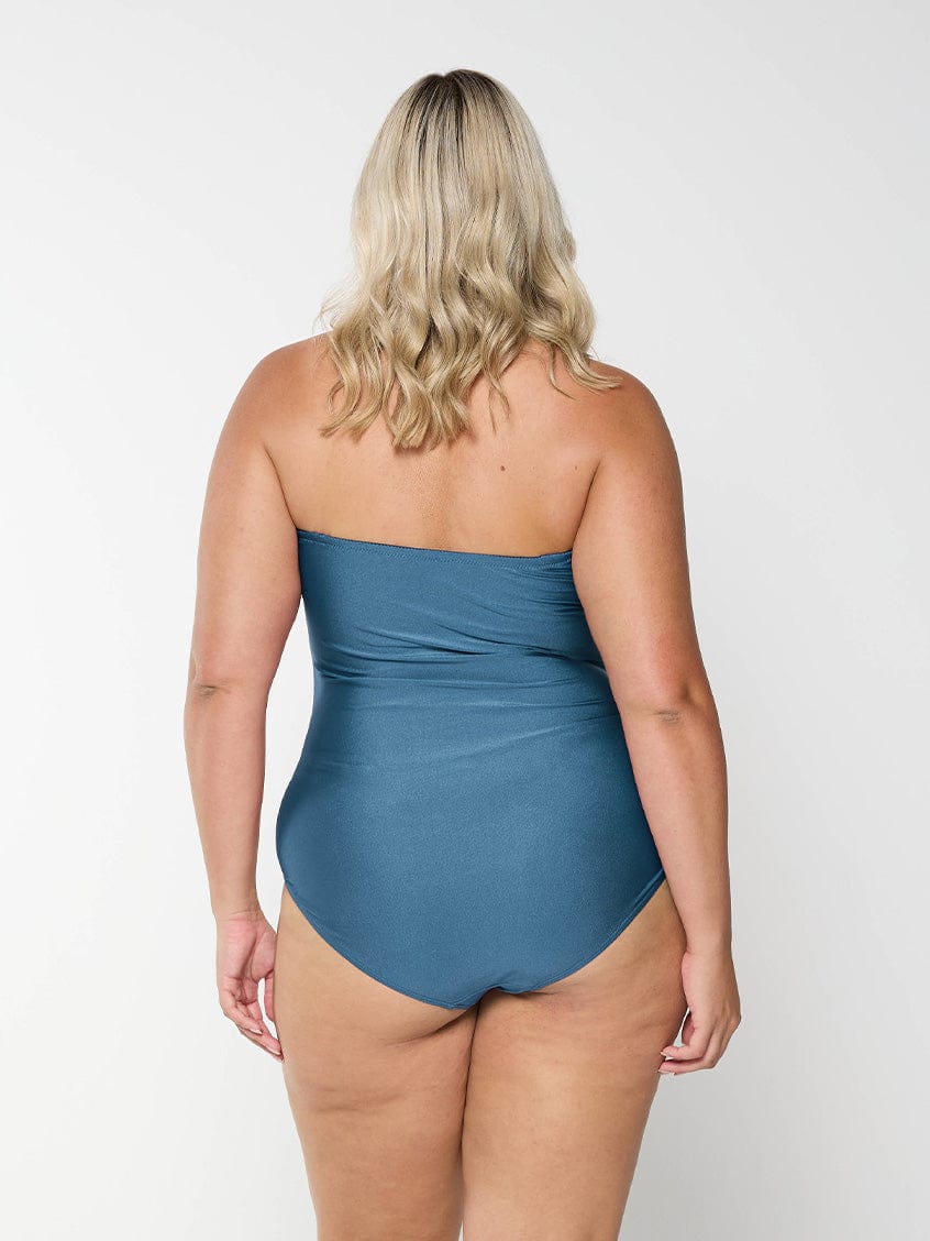 model showing back of shiny grey swimsuit