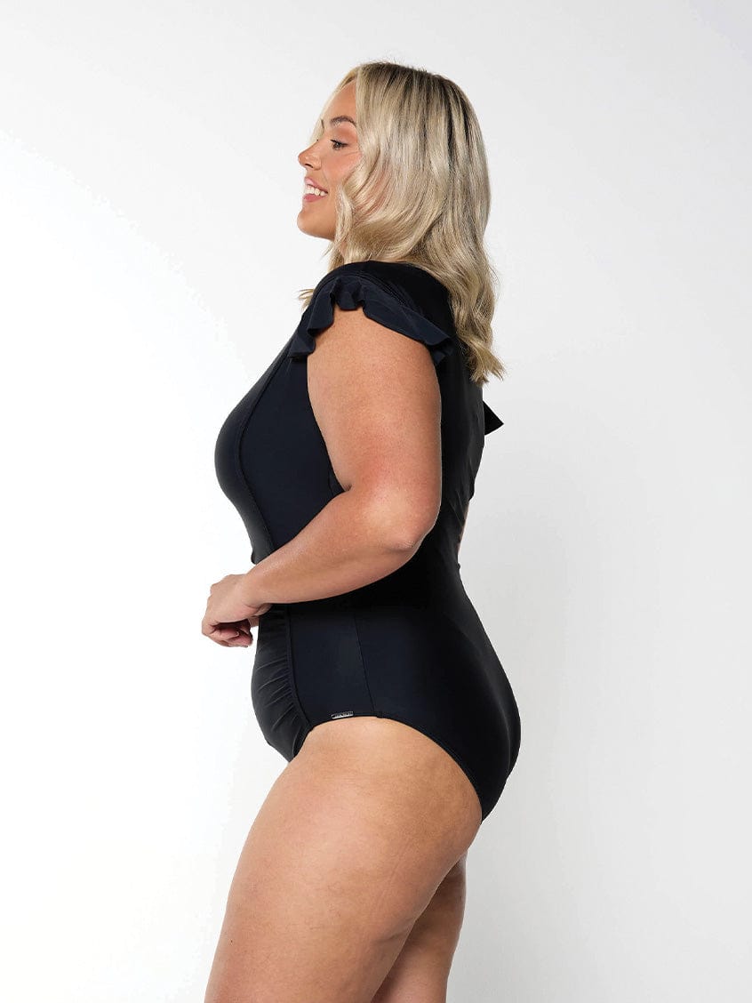 Model showing side of black frill sleeve one piece modest