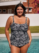 Brunette model by pool wearing flattering tank tankini top in chlorine resistant