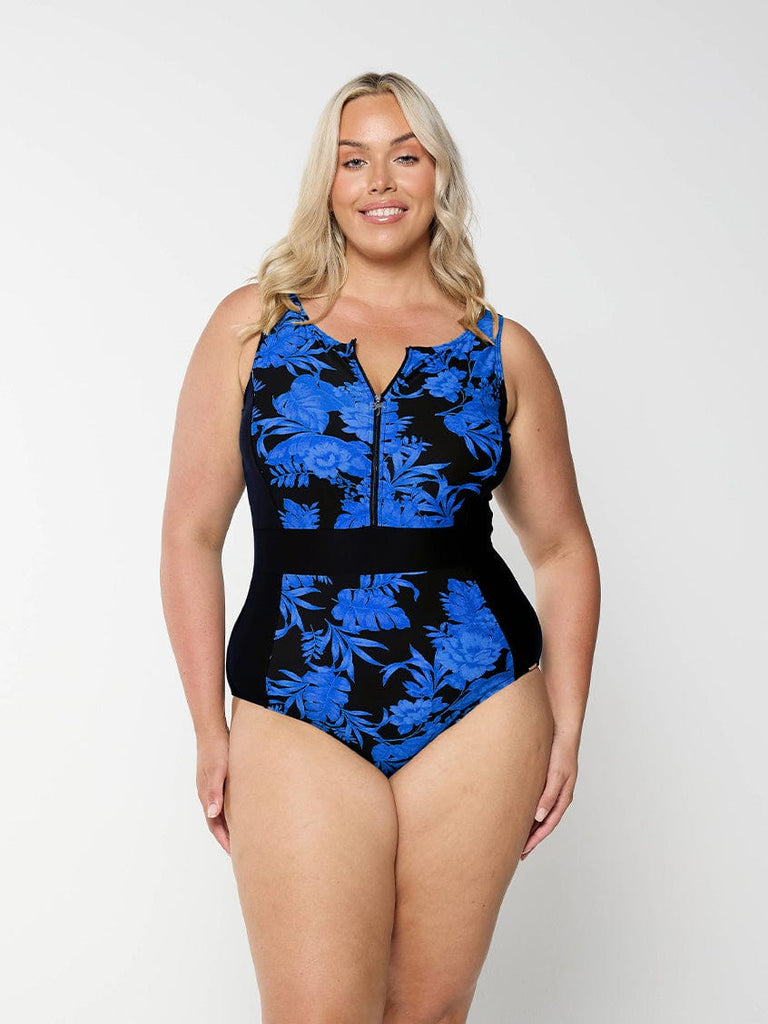 model wearing blue and black floral women's zip up one piece
