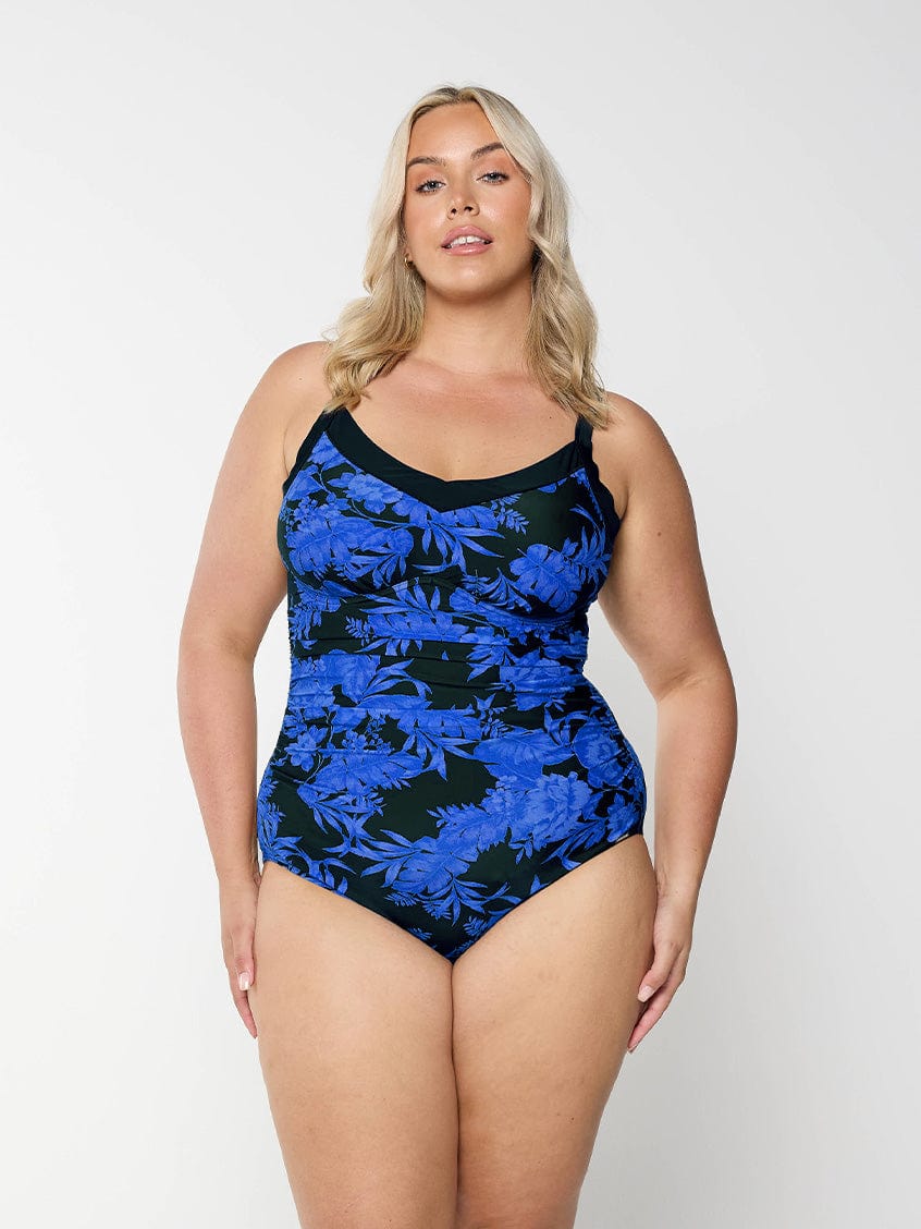 model wearing blue and black floral underwire one piece