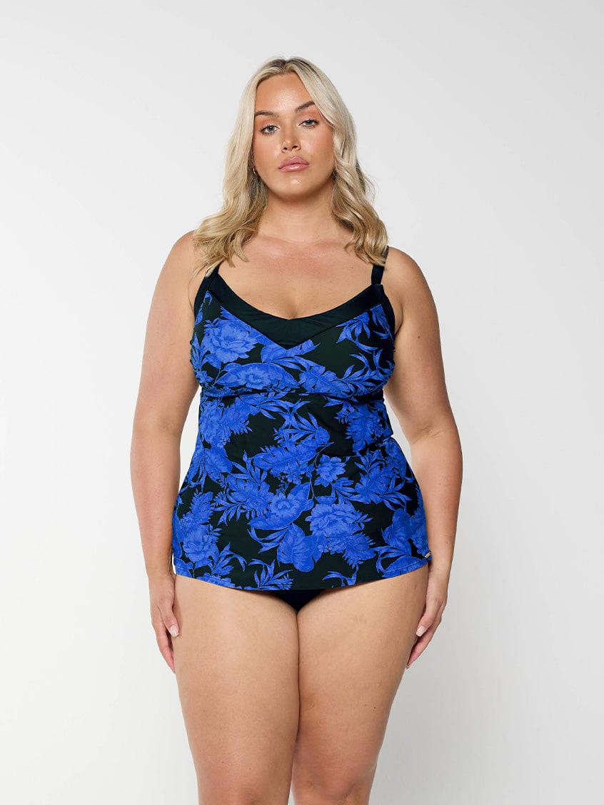 model wearing blue and black floral underwire women's tankini top
