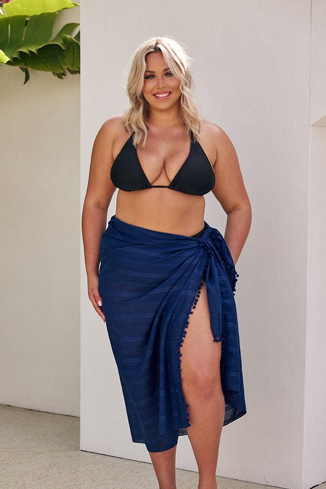 Blonde model wearing long navy sarong