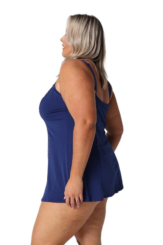 Model wearing navy and white dots swim dress