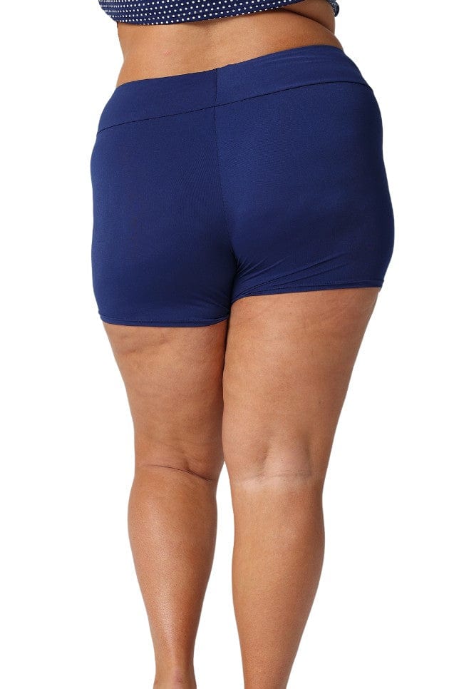 Model showing back of navy boyleg swim bottoms