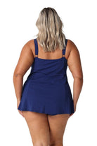 Model showing back of navy wide strap swim dress