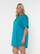 Model in studio wearing oversized coverup dress