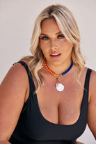 Blonde model wearing unique hanging peal sea shell charm for handmade beaded necklaces