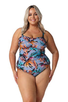 Model wearing tropical print bandeau one piece