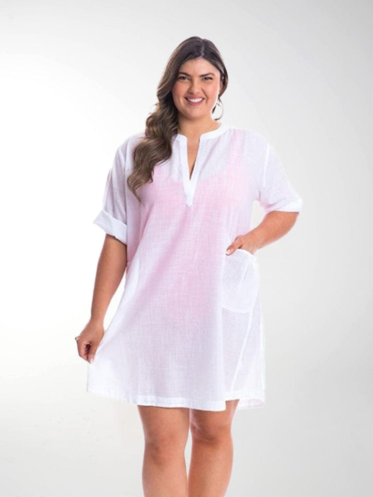Model in studio wearing cotton overshirt dress in white cotton