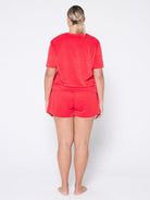 Person wearing a red outfit on a white background